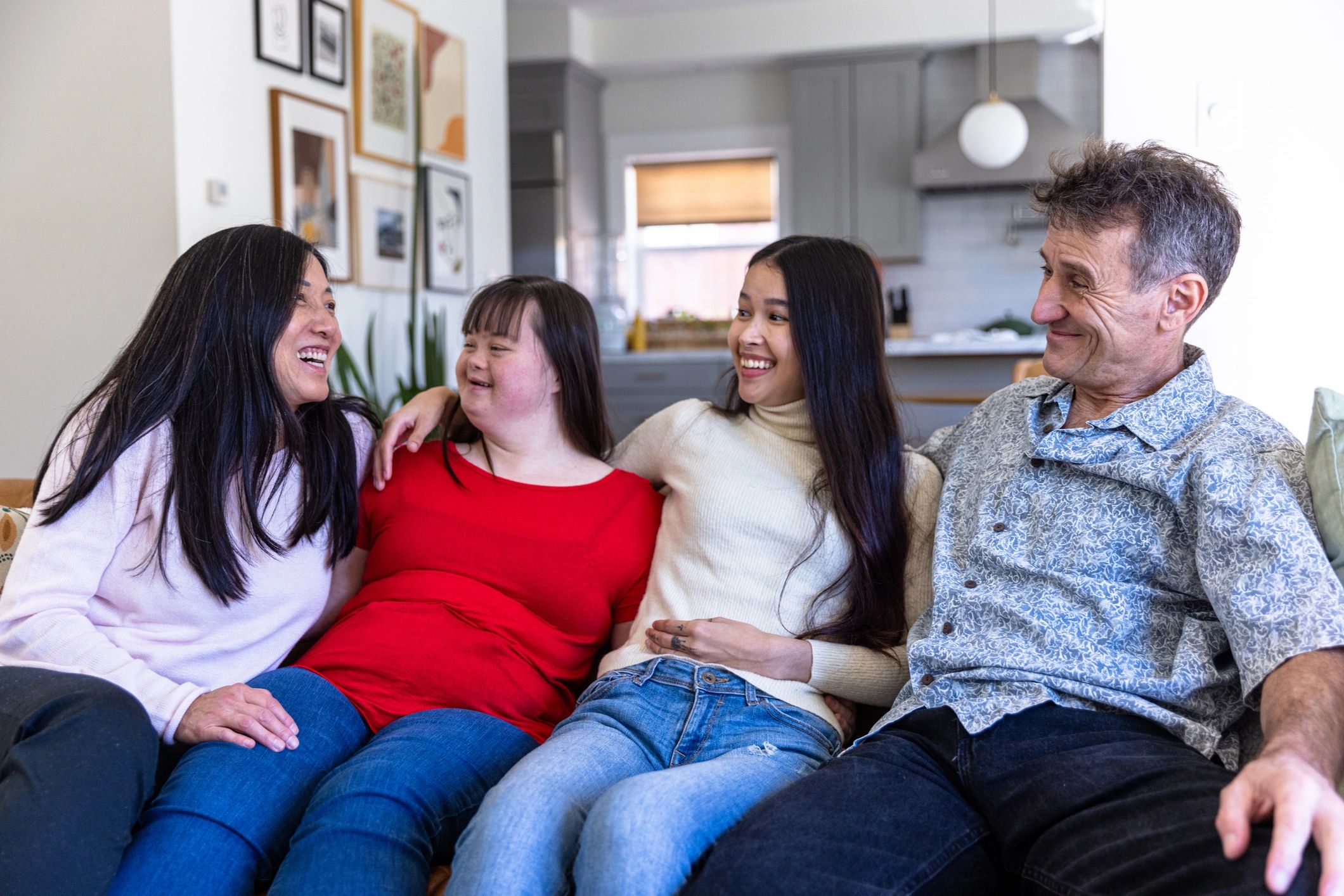 Family sitting together on a couch at home