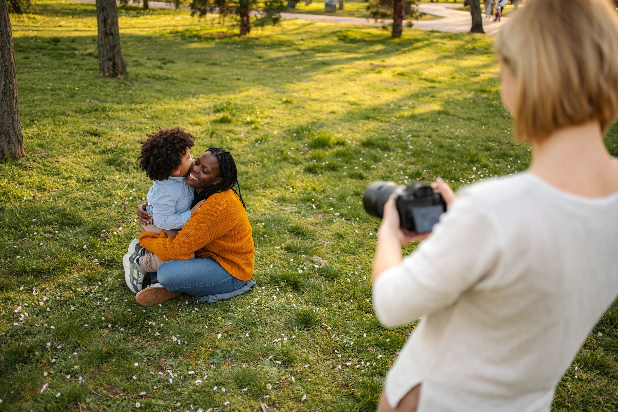 Mother and son smiling outdoors