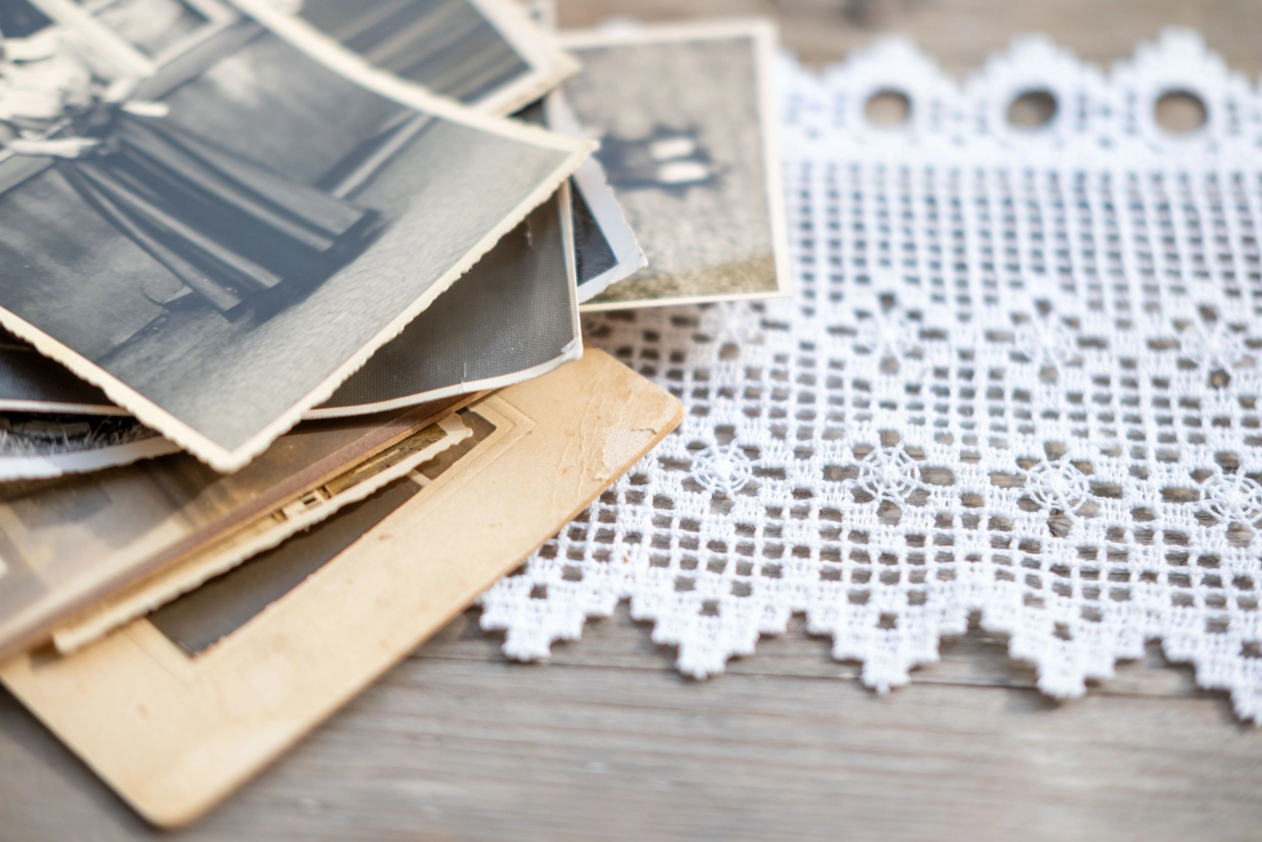 Stack of vintage family photographs representing preserved memories